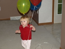 Carrying her balloons