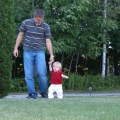 Kaitlyn and Dad walking in the front yard