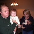 Grandparents holding the babies