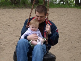Dad and Kaitlyn on the tire swing