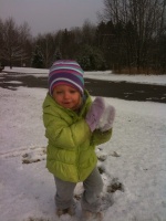Kaitlyn throwing snowballs at Dad