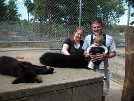 Kaitlyn, Mom, and Dad with 2 bear cubs at Oswald's Bear Ranch