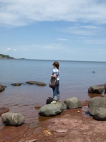 Ginger on the phone by Lake Superior