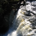 Water flowing over the edge of Laughing Whitefish Falls