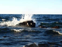 Wave crashing into a rock