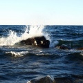 Wave crashing into a rock