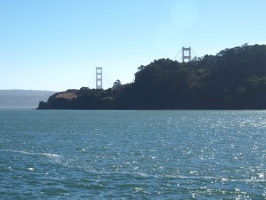 Golden Gate Bridge appearing over the hills