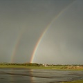 Double Rainbow reflecting of the tarmac